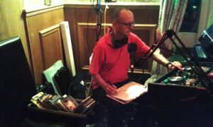 DJ in Swansea, Martin  using CD's at Purple Badger, Llanrhidian. June 2016